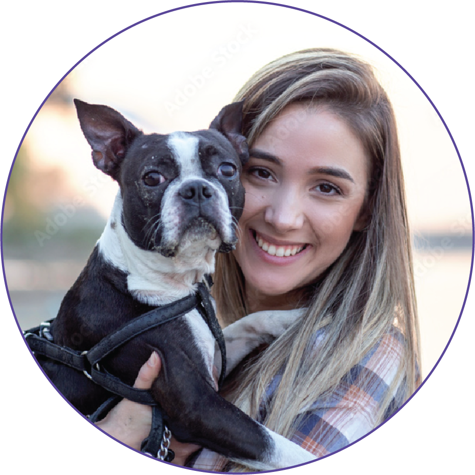 A woman holding a dog in her arms.